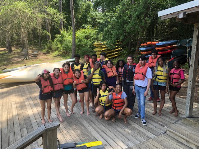 MMERI Scholars students on an outdoor kayaking excursion wearing life vests