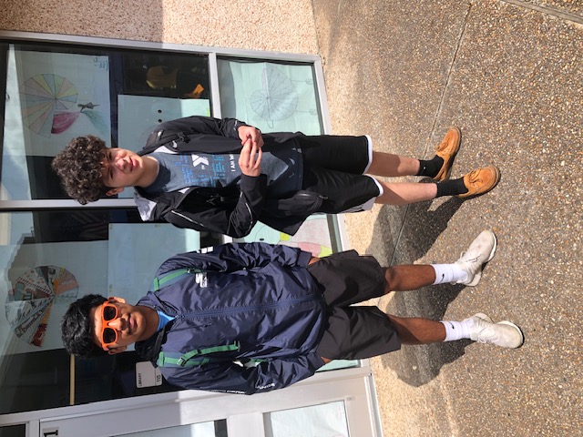 Two MMERI Scholars students standing outside a school building